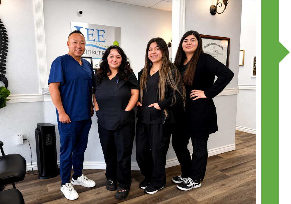 Group of staff standing in a chiropractic office lobby